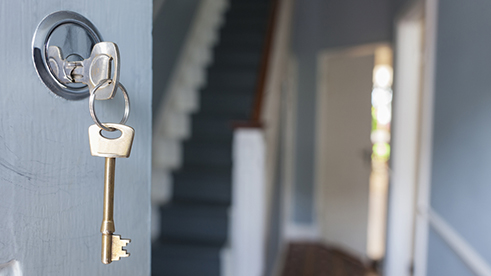 Keys in the lock of a house's front door